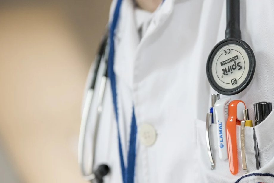 a stethoscope and pens