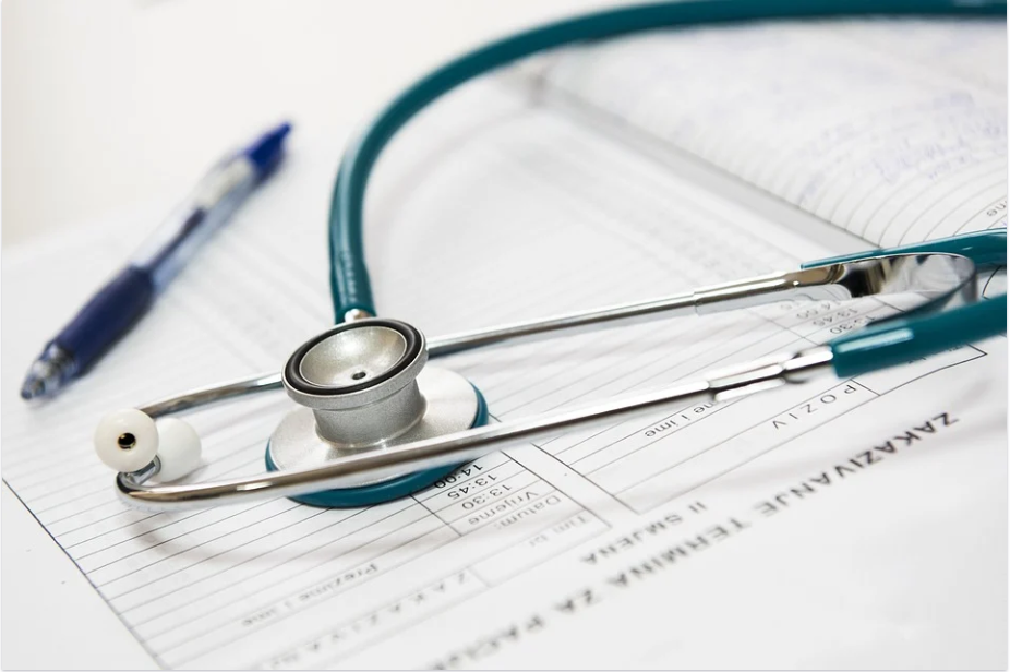 a stethoscope and a pen
